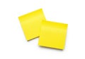Two bright yellow sticky notes isolated on white background Royalty Free Stock Photo