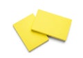 Two bright yellow sticky notes overlapping isolated on white background Royalty Free Stock Photo