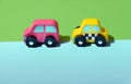 Two brightly colored wooden toy cars Royalty Free Stock Photo