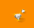 Two Brilliant Diamonds with Glimmering Light on Orange Royalty Free Stock Photo