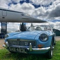 Two British icons, Concorde & MGB. Royalty Free Stock Photo