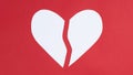 The Two  Broken Halves Of One Big White Heart. Red Background. Symbol Of Love. Greeting Card. Valentine`s Day Holiday