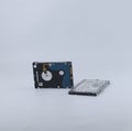 two broken laptop hard drives isolated on a white background Royalty Free Stock Photo