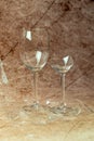Two broken wine glasses on a bright background Royalty Free Stock Photo