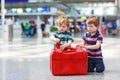 Two brother boys going on vacations trip at airport Royalty Free Stock Photo