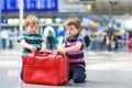 Two brother boys going on vacations trip at airport Royalty Free Stock Photo