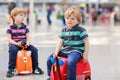 Two brother boys going on vacations trip at airport Royalty Free Stock Photo