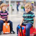 Two brother boys going on vacations trip at airport Royalty Free Stock Photo