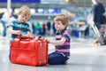Two brother boys going on vacations trip at airport Royalty Free Stock Photo