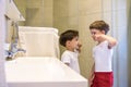 Two brothers brush my teeth in the bathroom.The beginning of a new day Royalty Free Stock Photo