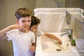 Two brothers brush my teeth in the bathroom.The beginning of a new day Royalty Free Stock Photo