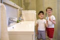 Two brothers brush my teeth in the bathroom.The beginning of a new day Royalty Free Stock Photo