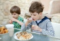 Two brothers eat healthy breakfast