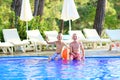 Two brothers enjoying swimming pool Royalty Free Stock Photo