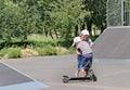 Two brothers fighting over a scooter