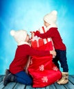 Two brothers found a bag with gifts from Santa Claus.Merry Christmas and happy holidays! Royalty Free Stock Photo