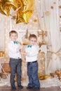 Two brothers in a gold Christmas decorations