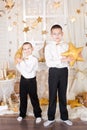 Two brothers in a gold Christmas decorations