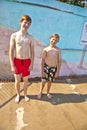 Two brothers having fun in the pool Royalty Free Stock Photo