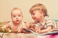 Two brothers lie on the bed Royalty Free Stock Photo