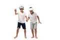 Two brothers looking at camera and dancing while listening music in headphones Royalty Free Stock Photo