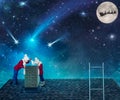 Two brothers looking for fallen star in the chimney.Children on Christmas night standing on the roof and looking at the star fall. Royalty Free Stock Photo