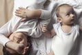 Two brothers lying and posing. Portrait of brothers. Two months baby boy and five years small boy playing cheerfully. View from Royalty Free Stock Photo