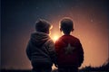 Two brothers making a wish looking at star Royalty Free Stock Photo