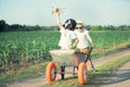 Two brothers play together in the field.Child pilot aviator with airplane dreams of traveling. Royalty Free Stock Photo