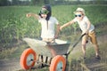 Two brothers play together in the field.Child pilot aviator with airplane dreams of traveling. Royalty Free Stock Photo