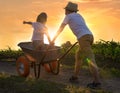 Two brothers play together in the field.Child pilot aviator dreams of traveling. Royalty Free Stock Photo