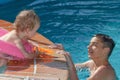 Two brothers playing in the pool Royalty Free Stock Photo