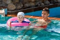 Two brothers playing in the pool Royalty Free Stock Photo