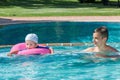 Two brothers playing in the pool Royalty Free Stock Photo