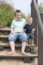 Two brothers playing together on the beach Royalty Free Stock Photo