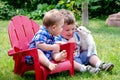 Two brothers and puppy kiss Royalty Free Stock Photo