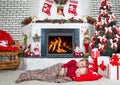 Merry Christmas and Happy Holidays!Two brothers sleep in the living room on the floor under the tree.In anticipation of gifts from Royalty Free Stock Photo