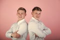 Two brothers smiling on pink background Royalty Free Stock Photo