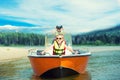 Two brothers swim on a motor boat on the lake. Royalty Free Stock Photo