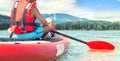 Two brothers swimming on stand up paddle board.Water sports , active lifestyle.