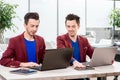 Two brothers twins working at the office Royalty Free Stock Photo