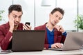 Two brothers twins working at the office Royalty Free Stock Photo