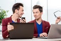 Two brothers twins working at the office Royalty Free Stock Photo