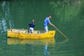 Two brothers young boy and a small child fishing alone with th