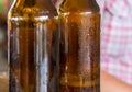 Two brown bottles of beer with droplets evaporated close-up, empty Royalty Free Stock Photo