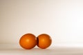 Two brown chicken eggs, lying side by side. Royalty Free Stock Photo