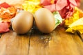 Two brown Easter eggs on crumpled colorful paper. Close-up. Sweet easter concept. Healthy food. Flat lay, top view Royalty Free Stock Photo