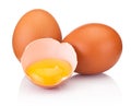 Two brown eggs and one is broken isolated white on white background Royalty Free Stock Photo