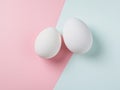 Two brown eggs sit next to each other on a white background Royalty Free Stock Photo