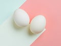 Two brown eggs sit next to each other on a white background Royalty Free Stock Photo
